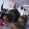 Former NFL player Merril Hoge meets with local youth to inspire them to chase their dreams