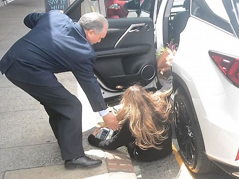 Elle Macpherson Takes a Nasty Fall Getting Into Her Car