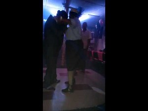 Old couple getting freaky on the dance floor.