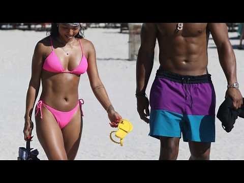 Karrueche Tran Bikining on Beach in Miami in Tiny Pink Bikini
