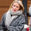 Naomi Watts bundles up in a checked coat as she enjoys a chilly stroll with son Kai