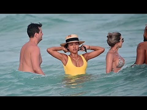 Karrueche Tran braves the waves in Miami wearing sunny swimsuit