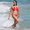 Padma Lakshmi, 48, of Top Chef flaunts her fabulous bikini body in a scarlet two-piece on Miami girls trip